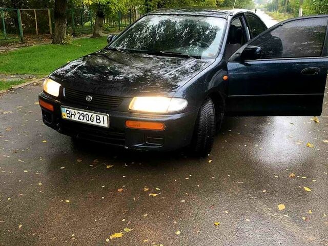 Зелений Мазда 323, об'ємом двигуна 1.8 л та пробігом 250 тис. км за 1950 $, фото 1 на Automoto.ua