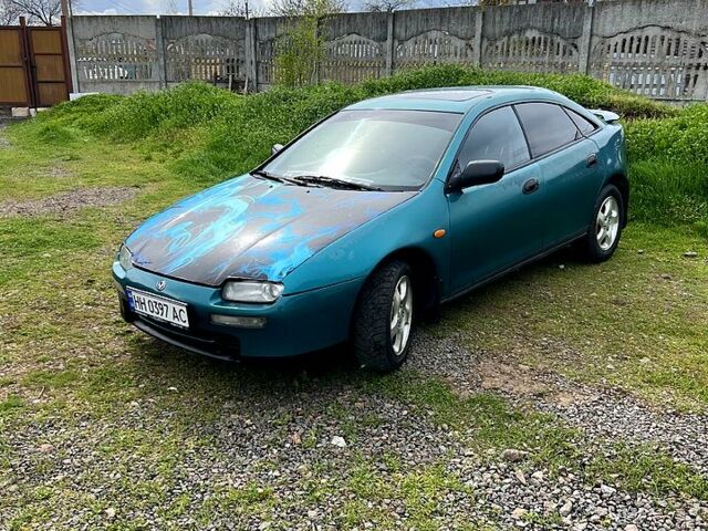 Зелений Мазда 323, об'ємом двигуна 1.5 л та пробігом 440 тис. км за 2100 $, фото 1 на Automoto.ua