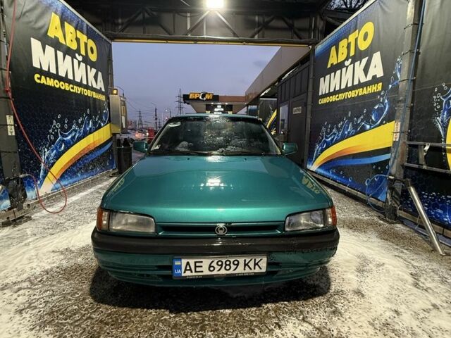 Зелений Мазда 323, об'ємом двигуна 1.6 л та пробігом 3 тис. км за 2300 $, фото 1 на Automoto.ua