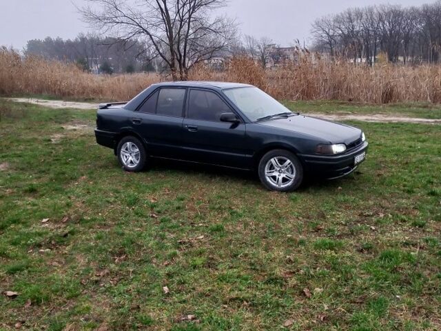 Зелений Мазда 323, об'ємом двигуна 1.6 л та пробігом 333 тис. км за 950 $, фото 1 на Automoto.ua