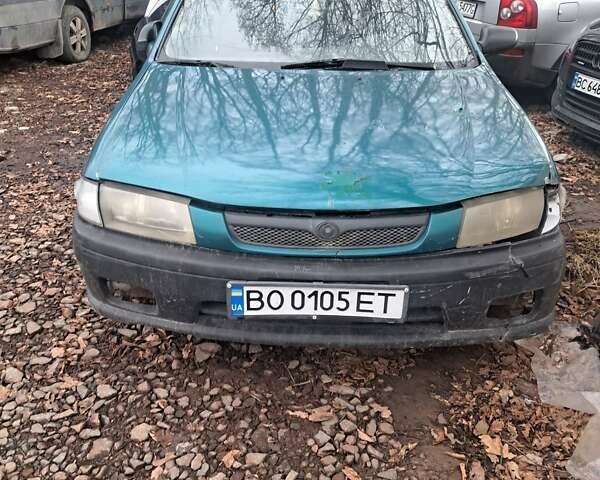 Зеленый Мазда 323, объемом двигателя 1.5 л и пробегом 200 тыс. км за 700 $, фото 1 на Automoto.ua