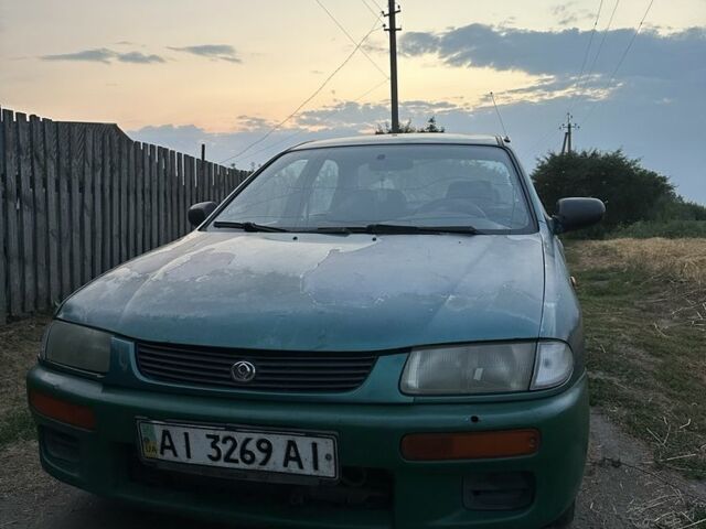 Зелений Мазда 323, об'ємом двигуна 1.8 л та пробігом 320 тис. км за 402 $, фото 1 на Automoto.ua