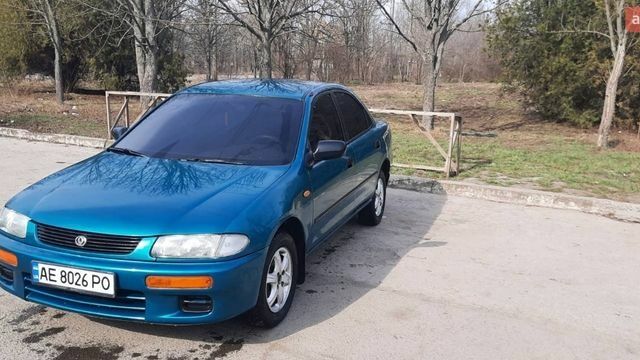 Зеленый Мазда 323, объемом двигателя 1.5 л и пробегом 350 тыс. км за 2200 $, фото 1 на Automoto.ua
