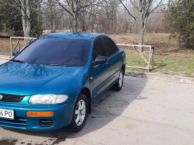 Зеленый Мазда 323, объемом двигателя 1.5 л и пробегом 350 тыс. км за 2200 $, фото 1 на Automoto.ua