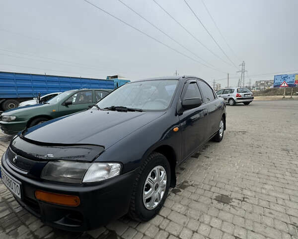 Зеленый Мазда 323, объемом двигателя 1.49 л и пробегом 234 тыс. км за 3100 $, фото 1 на Automoto.ua