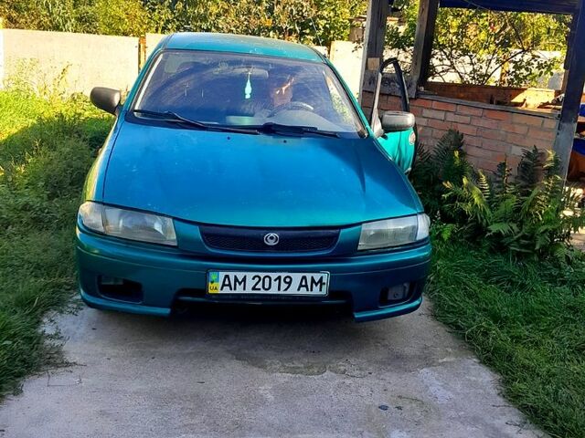 Зеленый Мазда 323, объемом двигателя 1.5 л и пробегом 254 тыс. км за 1800 $, фото 1 на Automoto.ua