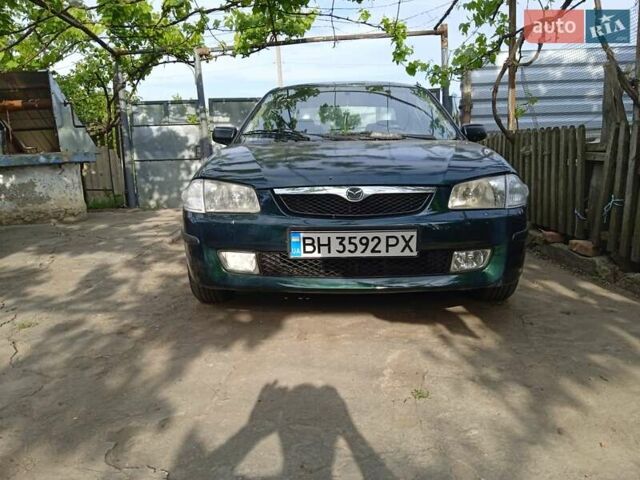 Зеленый Мазда 323, объемом двигателя 1.5 л и пробегом 185 тыс. км за 1700 $, фото 1 на Automoto.ua
