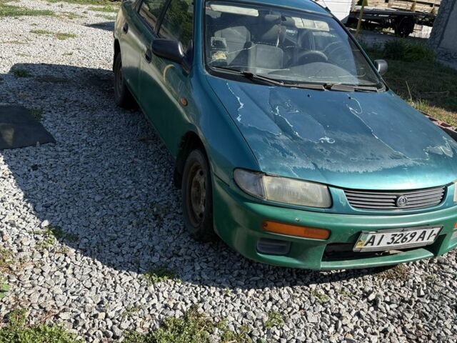 Зелений Мазда 323, об'ємом двигуна 1.8 л та пробігом 150 тис. км за 502 $, фото 1 на Automoto.ua