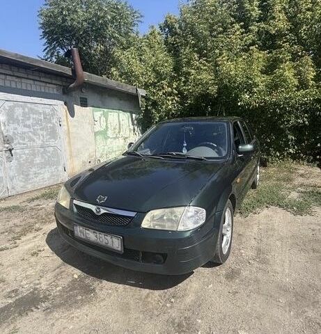 Зеленый Мазда 323, объемом двигателя 1.8 л и пробегом 320 тыс. км за 1004 $, фото 1 на Automoto.ua