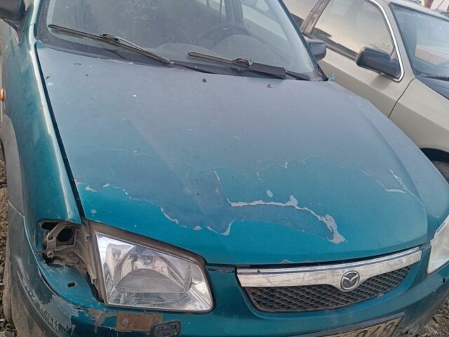 Зеленый Мазда 323, объемом двигателя 0 л и пробегом 300 тыс. км за 250 $, фото 1 на Automoto.ua