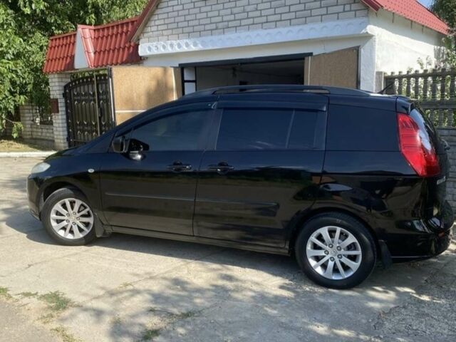 Черный Мазда 5, объемом двигателя 2 л и пробегом 175 тыс. км за 6830 $, фото 1 на Automoto.ua