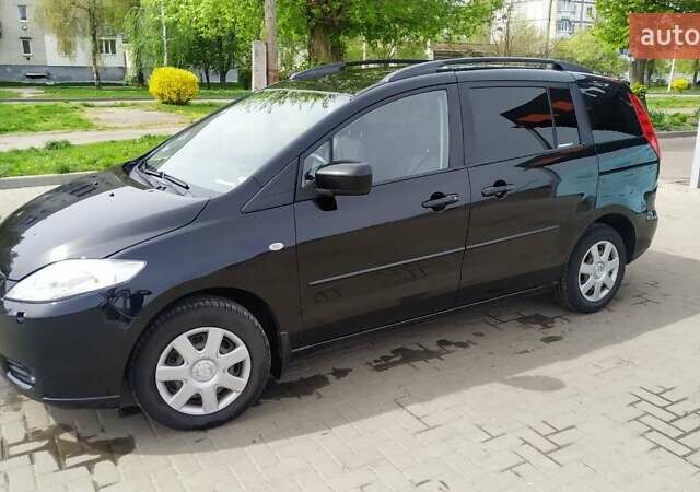 Черный Мазда 5, объемом двигателя 2 л и пробегом 260 тыс. км за 5900 $, фото 1 на Automoto.ua