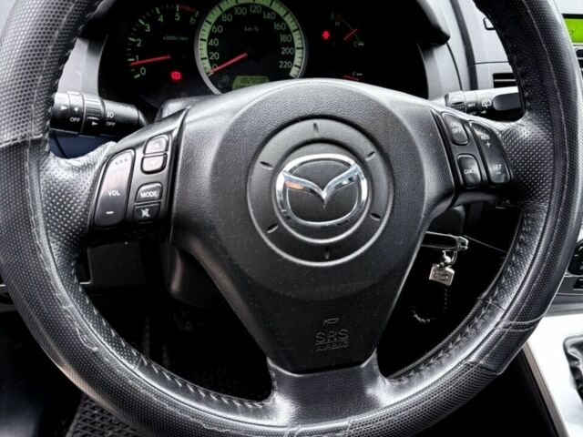 Чорний Мазда 5, об'ємом двигуна 2 л та пробігом 200 тис. км за 5600 $, фото 1 на Automoto.ua