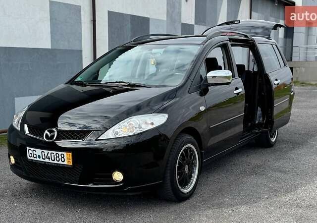 Черный Мазда 5, объемом двигателя 2 л и пробегом 220 тыс. км за 5899 $, фото 1 на Automoto.ua
