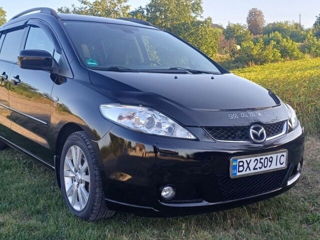 Черный Мазда 5, объемом двигателя 2 л и пробегом 276 тыс. км за 4550 $, фото 1 на Automoto.ua