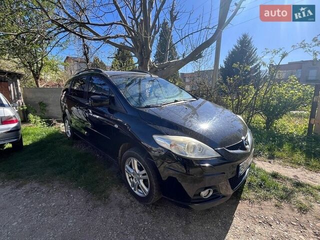 Черный Мазда 5, объемом двигателя 2 л и пробегом 243 тыс. км за 6499 $, фото 1 на Automoto.ua