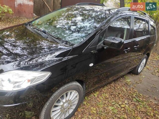 Черный Мазда 5, объемом двигателя 2 л и пробегом 212 тыс. км за 7000 $, фото 1 на Automoto.ua