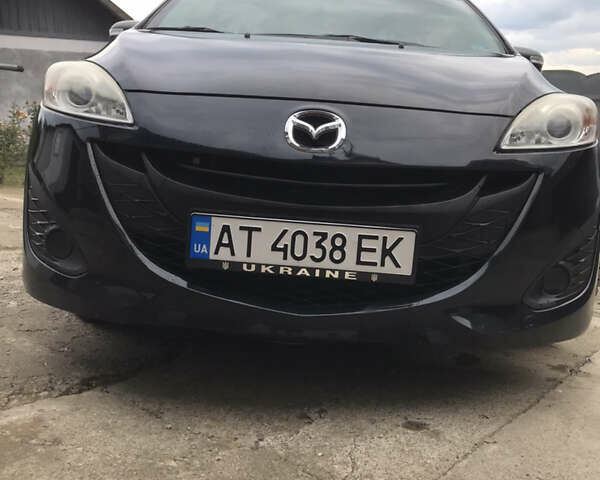 Черный Мазда 5, объемом двигателя 2.5 л и пробегом 143 тыс. км за 8100 $, фото 1 на Automoto.ua