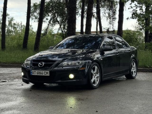Черный Мазда 5, объемом двигателя 2.3 л и пробегом 255 тыс. км за 6300 $, фото 1 на Automoto.ua