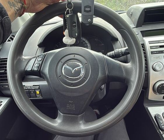 Черный Мазда 5, объемом двигателя 2 л и пробегом 550 тыс. км за 2000 $, фото 1 на Automoto.ua