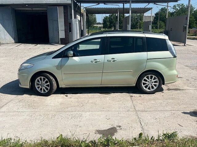 Желтый Мазда 5, объемом двигателя 2 л и пробегом 295 тыс. км за 3100 $, фото 1 на Automoto.ua