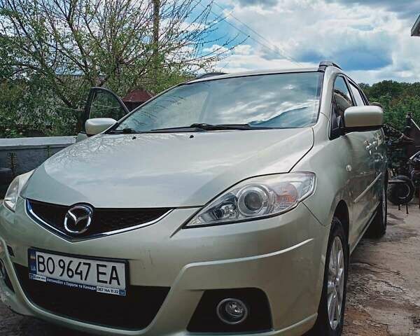 Желтый Мазда 5, объемом двигателя 2 л и пробегом 285 тыс. км за 5700 $, фото 1 на Automoto.ua