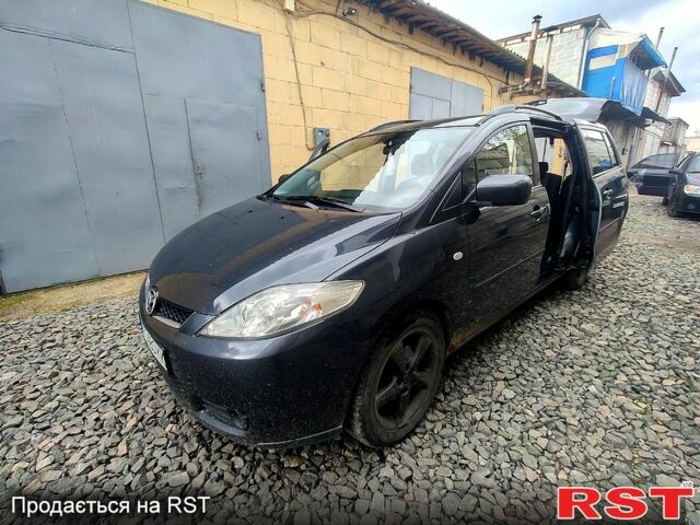 Серый Мазда 5, объемом двигателя 2 л и пробегом 200 тыс. км за 4800 $, фото 1 на Automoto.ua