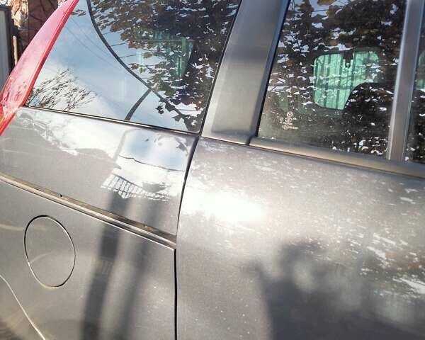 Серый Мазда 5, объемом двигателя 2 л и пробегом 240 тыс. км за 5200 $, фото 1 на Automoto.ua