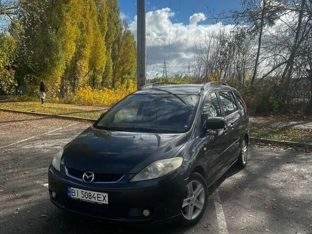 Серый Мазда 5, объемом двигателя 2 л и пробегом 280 тыс. км за 4600 $, фото 1 на Automoto.ua