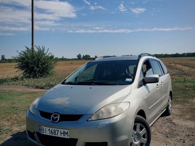 Серый Мазда 5, объемом двигателя 1.8 л и пробегом 315 тыс. км за 4000 $, фото 1 на Automoto.ua