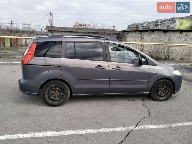 Серый Мазда 5, объемом двигателя 2 л и пробегом 268 тыс. км за 5500 $, фото 1 на Automoto.ua