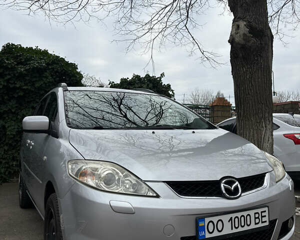 Серый Мазда 5, объемом двигателя 2 л и пробегом 257 тыс. км за 5700 $, фото 1 на Automoto.ua
