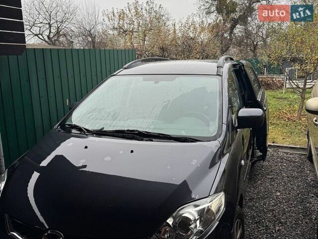 Серый Мазда 5, объемом двигателя 2 л и пробегом 174 тыс. км за 5700 $, фото 1 на Automoto.ua