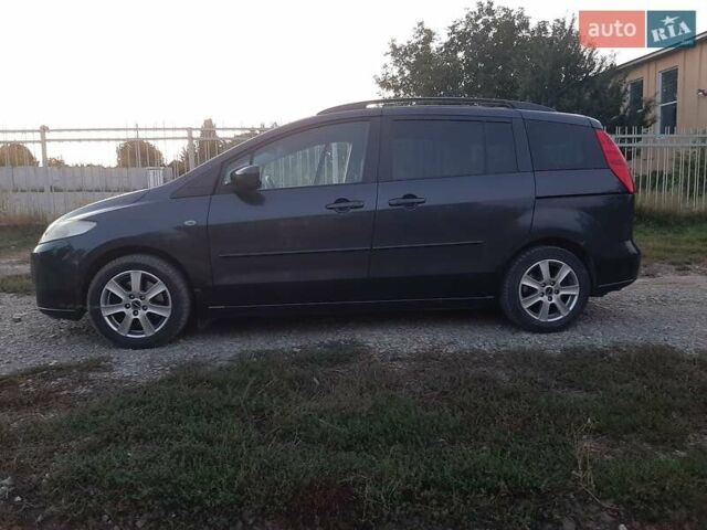 Серый Мазда 5, объемом двигателя 2 л и пробегом 241 тыс. км за 5500 $, фото 1 на Automoto.ua