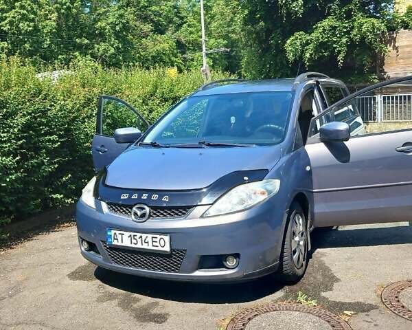Серый Мазда 5, объемом двигателя 2 л и пробегом 242 тыс. км за 4700 $, фото 1 на Automoto.ua