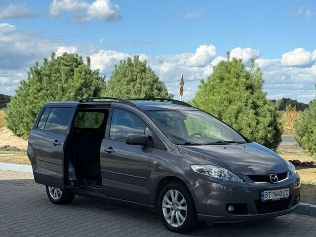 Серый Мазда 5, объемом двигателя 2 л и пробегом 267 тыс. км за 4499 $, фото 1 на Automoto.ua