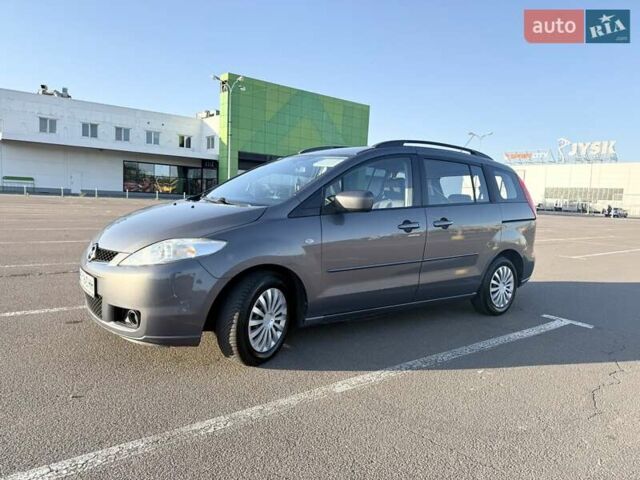 Серый Мазда 5, объемом двигателя 2 л и пробегом 233 тыс. км за 6200 $, фото 1 на Automoto.ua