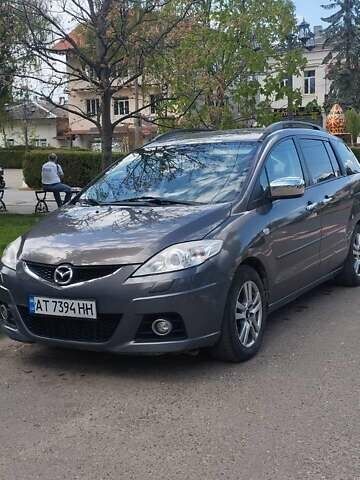 Серый Мазда 5, объемом двигателя 2 л и пробегом 236 тыс. км за 7000 $, фото 1 на Automoto.ua