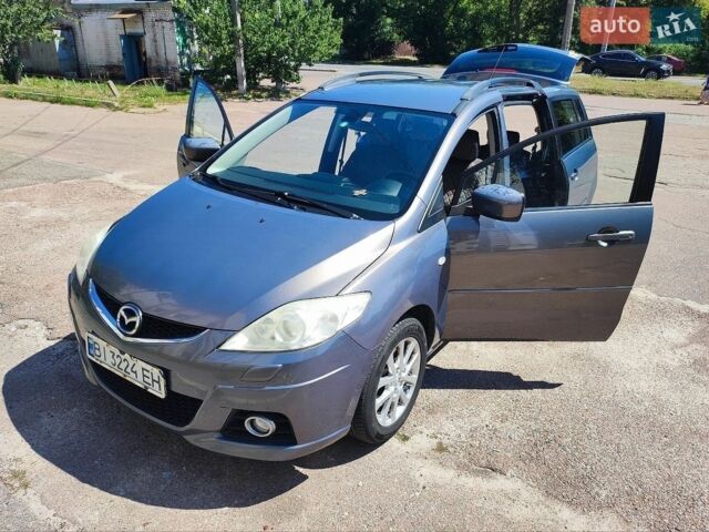 Серый Мазда 5, объемом двигателя 2 л и пробегом 231 тыс. км за 6500 $, фото 1 на Automoto.ua