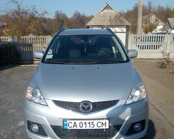 Серый Мазда 5, объемом двигателя 2 л и пробегом 250 тыс. км за 7300 $, фото 1 на Automoto.ua
