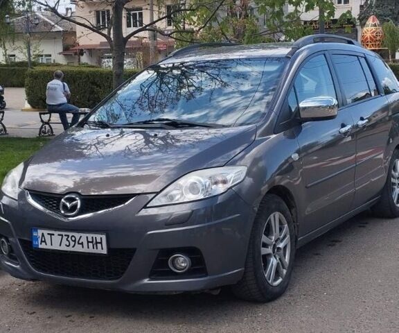 Серый Мазда 5, объемом двигателя 2 л и пробегом 236 тыс. км за 7000 $, фото 1 на Automoto.ua