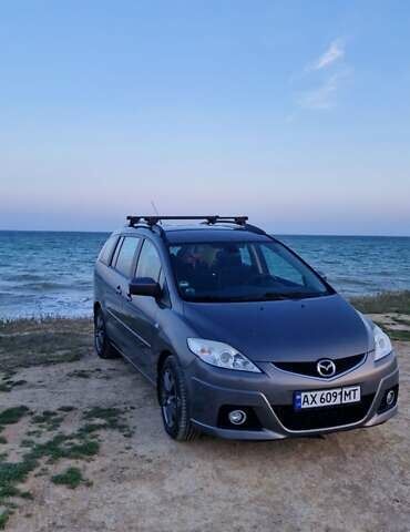 Серый Мазда 5, объемом двигателя 2 л и пробегом 290 тыс. км за 6474 $, фото 1 на Automoto.ua