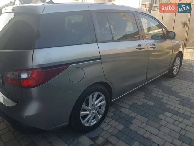 Серый Мазда 5, объемом двигателя 1.6 л и пробегом 210 тыс. км за 7600 $, фото 1 на Automoto.ua