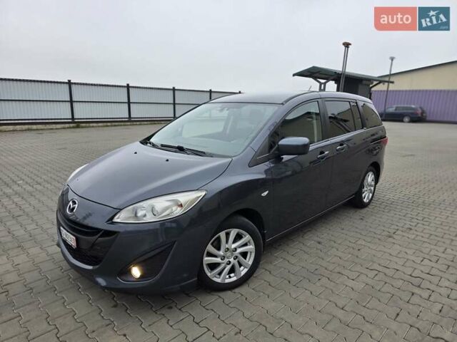 Серый Мазда 5, объемом двигателя 2 л и пробегом 280 тыс. км за 6650 $, фото 1 на Automoto.ua