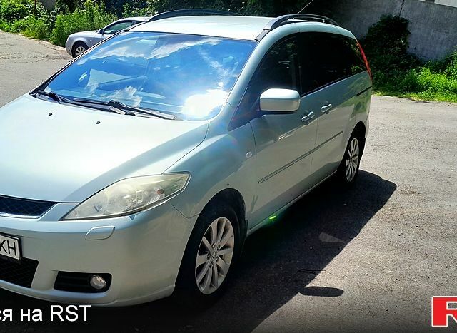 Синий Мазда 5, объемом двигателя 2 л и пробегом 350 тыс. км за 4200 $, фото 1 на Automoto.ua