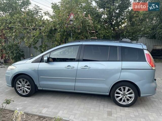 Синий Мазда 5, объемом двигателя 2 л и пробегом 243 тыс. км за 6000 $, фото 1 на Automoto.ua