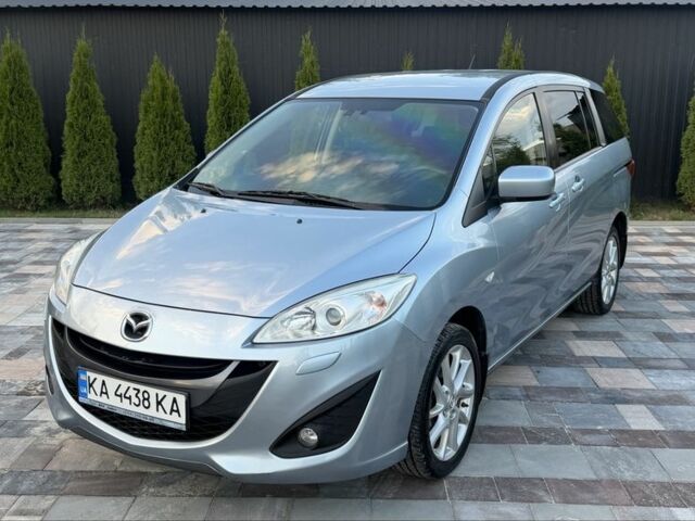 Синий Мазда 5, объемом двигателя 2 л и пробегом 217 тыс. км за 7518 $, фото 1 на Automoto.ua