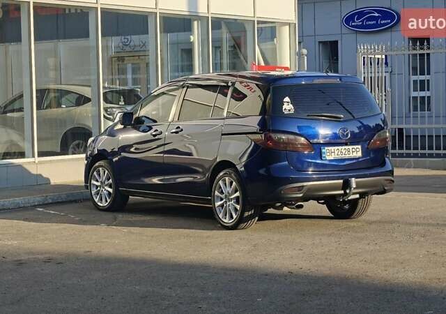 Синий Мазда 5, объемом двигателя 2 л и пробегом 242 тыс. км за 9800 $, фото 1 на Automoto.ua