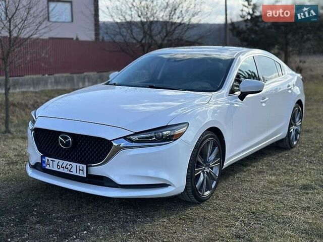 Белый Мазда 6, объемом двигателя 2.49 л и пробегом 95 тыс. км за 13700 $, фото 1 на Automoto.ua