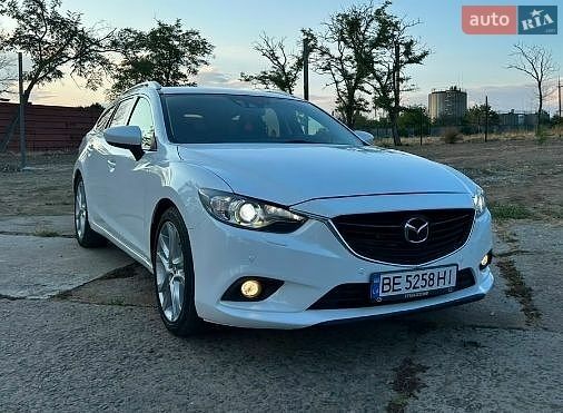 Белый Мазда 6, объемом двигателя 2.18 л и пробегом 130 тыс. км за 12600 $, фото 1 на Automoto.ua